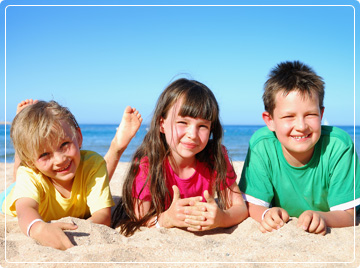 photo of three kids at beach